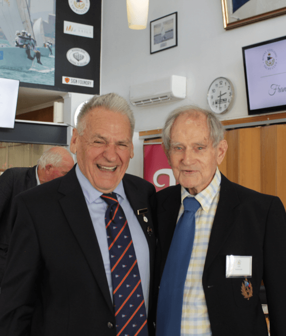 Immediate Past Commodore Paul Buchholz stands with 50 year member and 101 year old member Jack Anderson for a photo.